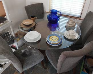 glass top dining table with 4 chairs (one chair has stain on seat), dish sets