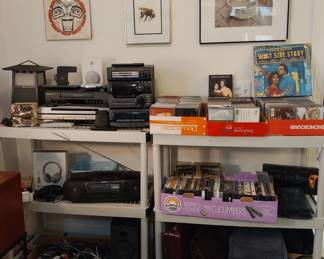 AR Bluetooth speaker, Google Nest Mini, Panasonic VHS, Sony DVD, JVC DVD, JVC compact stereo system, iHome Bluetooth speaker, Sony boom box, Sky Eon headphones