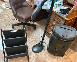 Staples high-speed Shredder $40, adjustable Floor Lamp $25, three section vinyl and metal standup rack $18
