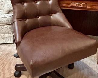 Brown desk chair on five caster Leggs $45