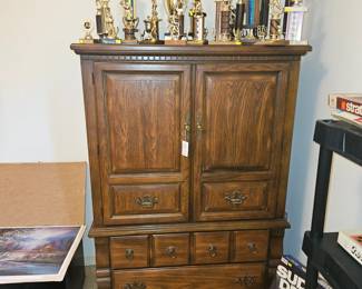 Chest of drawers and various trophys