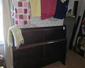 Awesoome wood double sleigh bed with crocheted items