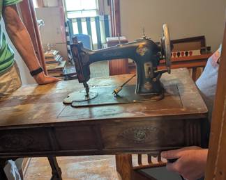 Sewing machine with table
