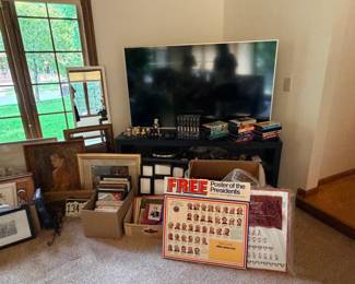 picture frames and artwork, wall clocks, TV and TV stand, record player