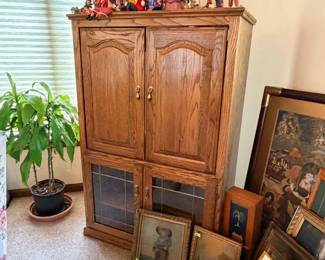 TV Armoire, clown decor, picture frames and artwork