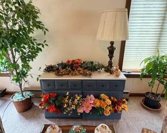 dresser, indoor plants, silk flowers