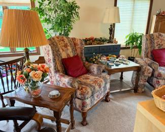 end table, table lamp, arm chair, silk flowers