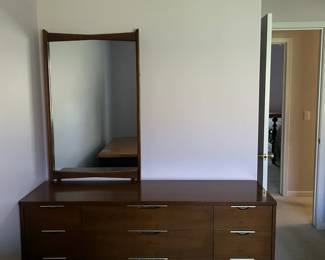Approximately 1960s, walnut finish, tapered legs, brushed brass/chrome pulls, sculpted headboard — in absolutely pristine condition. **Dresser with mirror $600. 5'5" long x 30.5" high. Mirror 44" long x 27"wide **3-drawer nightstand/chest $200. 3'long x 30.5" high **Headboard (bedframe if interested will include) -$150. Headbord 50" **As a complete set $800
