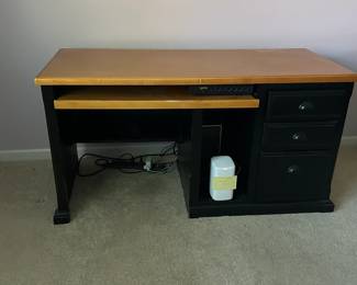 $50.00 modern computer desk — two-tone black base with a natural wood top, keyboard tray, three drawers on the right side. Condition: used, but functional for a home office Dimensions: 58"wide x 30" tall