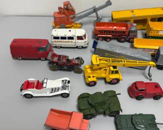 Closer view of the collection of vintage Matchbox Lesney die-cast vehicles from the 1960s, including "King Size" models; notable pieces in this lot include a Hoveringham Tipper truck, a Foden Breakdown Tractor, a Lesney Matchbox Models of Yesteryear 1928 Mercedes Benz 36/220, and various tank transporters. Also has a Dinky 670 Army Armored, 1955.