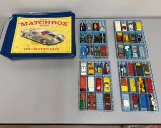 A vintage 1968 Matchbox Official Series collector's case manufactured by Lesney Products, containing four blue plastic interior trays holding die-cast miniature vehicles. This is sold as a set.