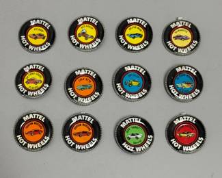 Vintage Mattel Hot Wheels buttons, showing Python, Red Baron, Splittin' Image, Silhouette, '36 Ford Coupe Classic, Lola GT70, Hot Heap, '31 Ford Woody Classic, Custom Mustang, Jack "Rabbit" Special, and Custom Fleetside