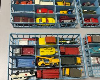 Closer views of the vintage 1968 Matchbox Official Series collector's case manufactured by Lesney Products, containing four blue plastic interior trays holding die-cast miniature vehicles. This is sold as a set.