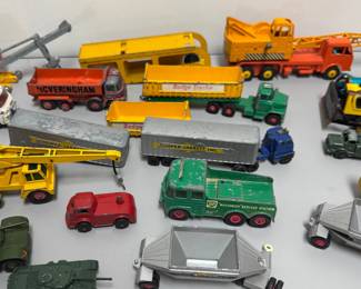 Closer view of the collection of vintage Matchbox Lesney die-cast vehicles from the 1960s, including "King Size" models; notable pieces in this lot include a Hoveringham Tipper truck, a Foden Breakdown Tractor, a Lesney Matchbox Models of Yesteryear 1928 Mercedes Benz 36/220, and various tank transporters. Also has a Dinky 670 Army Armored, 1955.