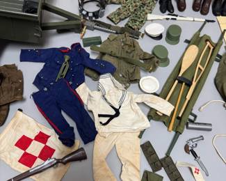 Closer view of the incredible rare vintage 1964 G.I. JOE action figure with multiple outfits (including camouflage, sailor, dress uniform, soldier, et al) and supplies including combat trailer, helmets, rifles, ammo belts, boots, underwater diving helmet, stretcher, lifejacket, and comes with original 1960s Hasbro G.I. Joe Action Soldier toy catalog.The poster features available action figures and their accessory sets for the 1964 catalogue year, including Army, Navy, Air Force, and Marine branches.
