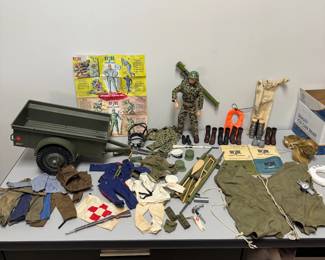 Incredible rare vintage 1964 G.I. JOE action figure with multiple outfits (including camouflage, sailor, dress uniform, soldier, et al) and supplies including combat trailer, helmets, rifles, ammo belts, boots, underwater diving helmet, stretcher, lifejacket, and comes with original 1960s Hasbro G.I. Joe Action Soldier toy catalog.The poster features available action figures and their accessory sets for the 1964 catalogue year, including Army, Navy, Air Force, and Marine branches.