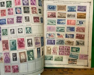 THE ARISTOCRAT WORLD STAMP ALBUM W/SEVERAL STAMPS