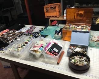 Small Sampling of fabric, thread spools, zippers, buttons, and more