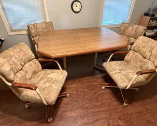 Table and 4 rolling chairs