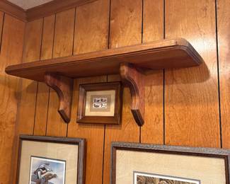 The shelf above the duck pictures is for sale also.