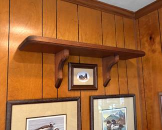 This picture is showing you the shelf above the duck pictures that is for sale.
