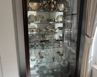Collection of Silver-Plated and Crystal Tableware in a Dark Wood Curio Cabinet