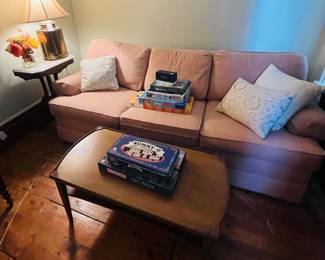 Light pink sofa, and end table, board games