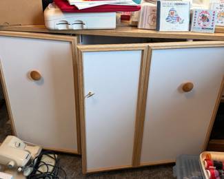 Sewing machine cabinet storage