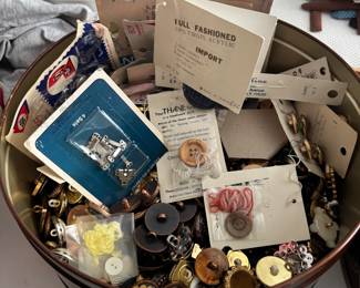 Tin of buttons