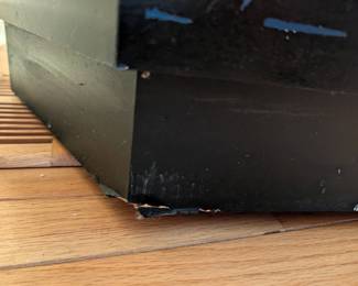 Some small damage at the bottom corner of the display tower