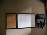 This is a memo board. Looks like pottery barn. You must bring your own screw drivers to take down.