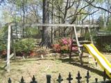 great wooden swing set. It has big bolts holding it together. You would have to take apart if you buy it.