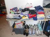 There is alot of little boy clothes andmany pairs of tennis shoes. Mens size 9