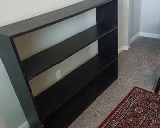 Wooden shelf for books and records, oriental rug