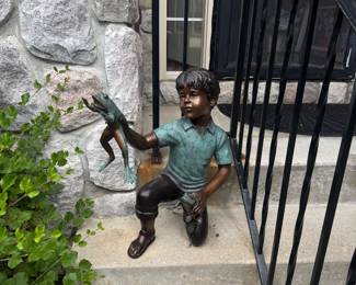 Bronze boy with two frogs