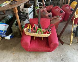 Assorted Garden Tools and Red Upholstered Chair