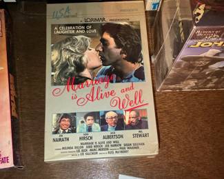 Collection of VHS Tapes and John Wayne Box Set