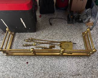 Vintage heavy brass fireplace fender and tools
