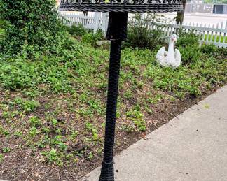 Tall wicker floor lamp in garage
