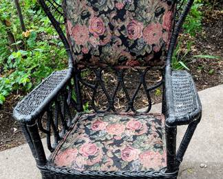 Antique wicker rocking chair in garage