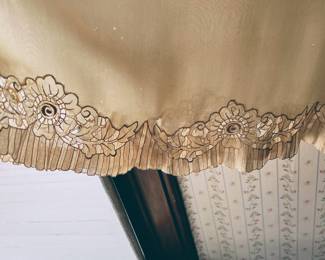 Decorative edge on vintage dress in main house