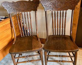 Two antique press back chairs in the guest house