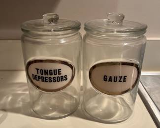Vintage glass canisters with lids in guest house