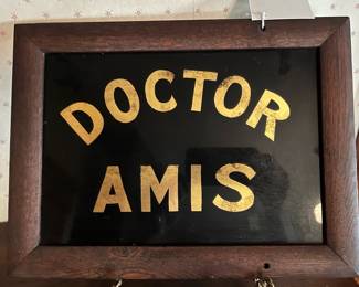 Antique heavy glass framed sign in the main house