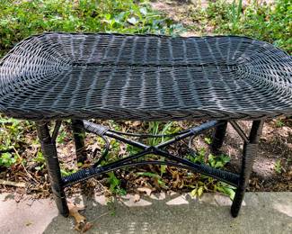 Black wicker coffee table in garage