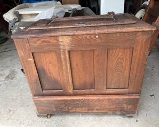 Antique wooden ice box in garage