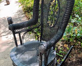 Black wicker rocker in garage