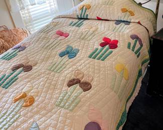 Antique iron twin size bed and quilt in main house