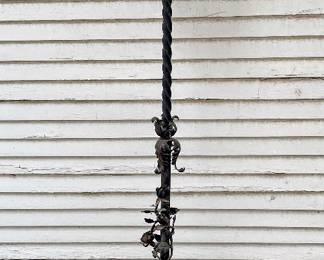 Antique wrought iron floor lamp. Needs rewired. Located in the garage.