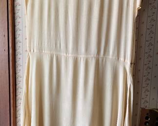 Vintage 1920s to 1930s dress in main house. Possibly silk.